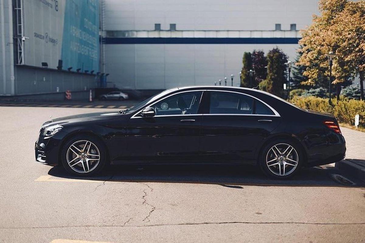 a black car parked in a parking lot
