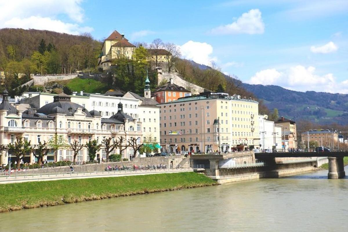 a city with a bridge over a river with buildings