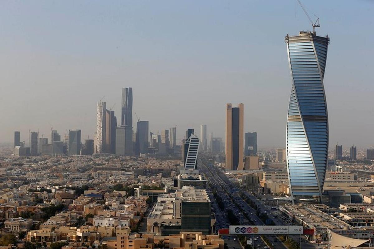 an aerial view of a city with tall buildings