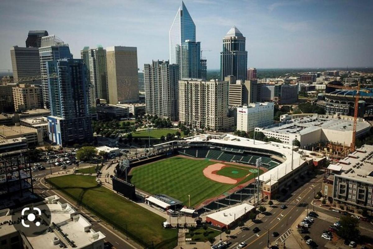 an aerial view of a baseball field in a city