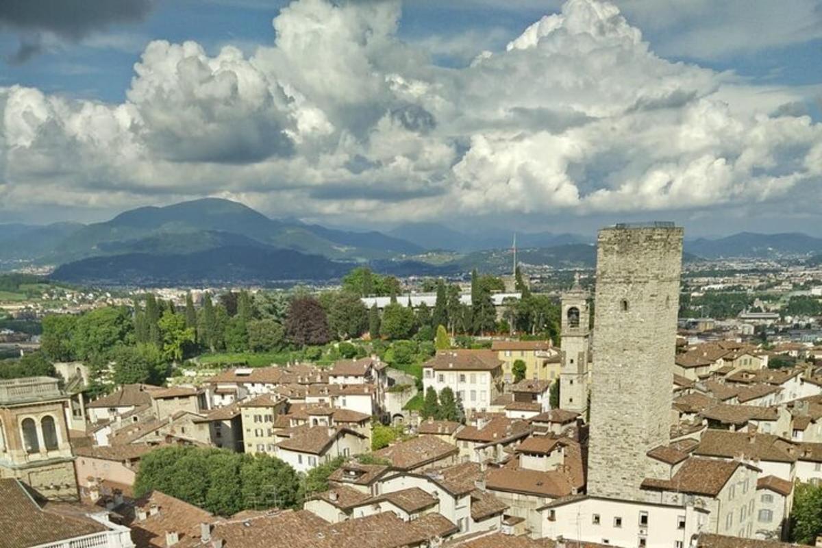 an aerial view of a town with a tower