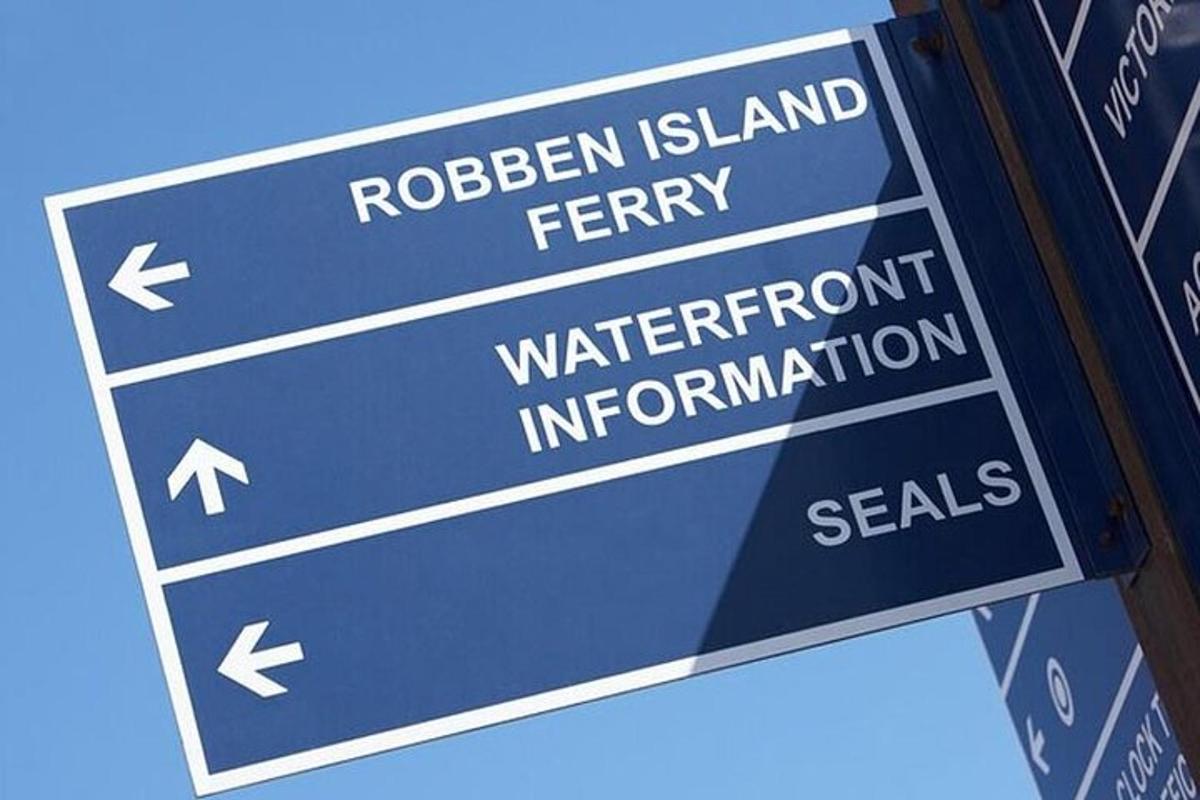 a blue street sign with the words rhodesian island fever and waterinant information
