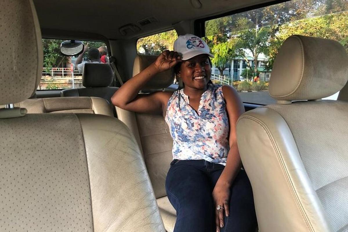 a woman sitting in the back seat of a car