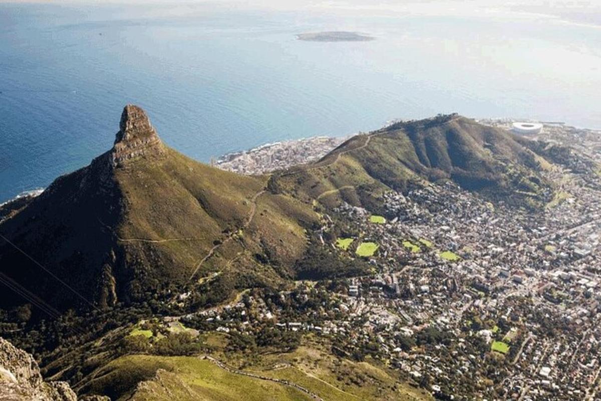 an aerial view of a mountain with a city