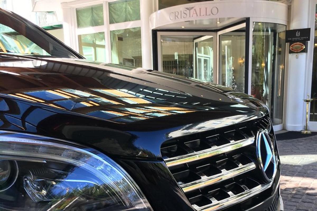 a black car parked in front of a store