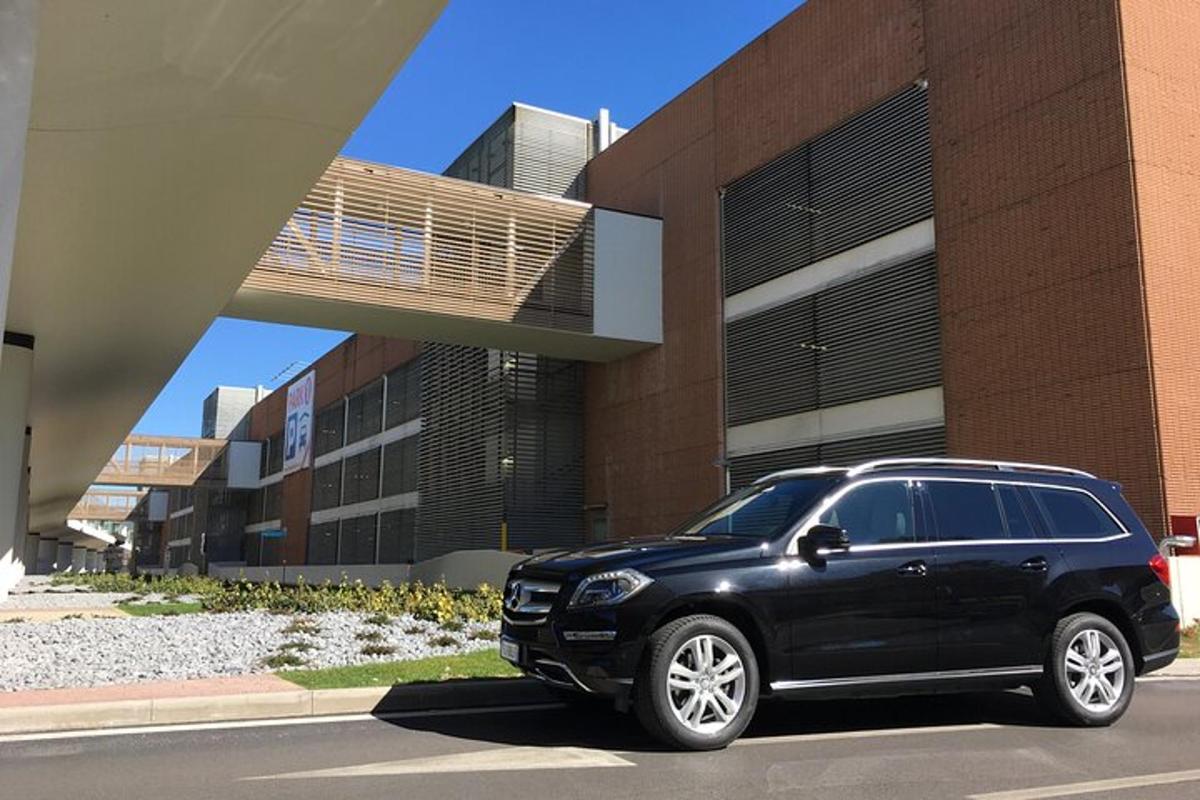 a black suv parked in front of a building