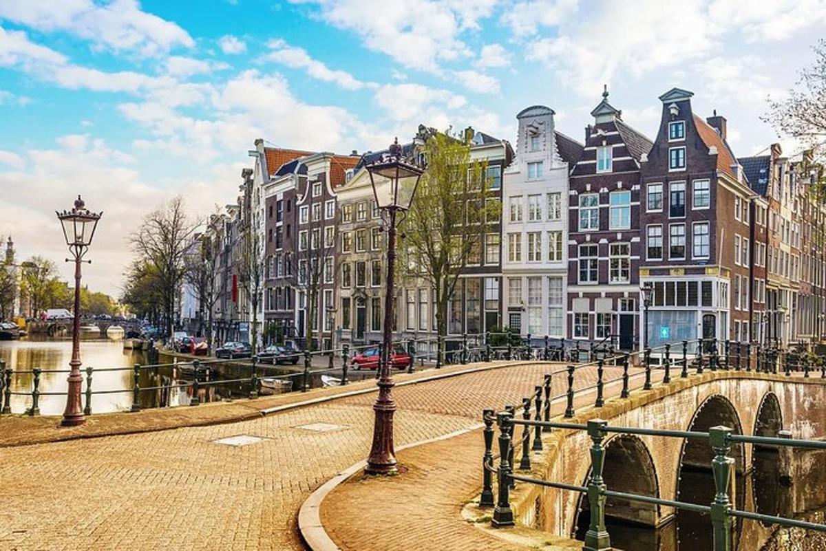 a street with buildings and a bridge and a canal