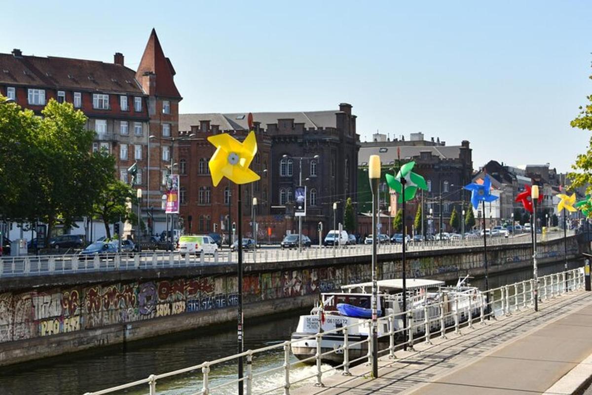 a river with boats docked next to a bridge