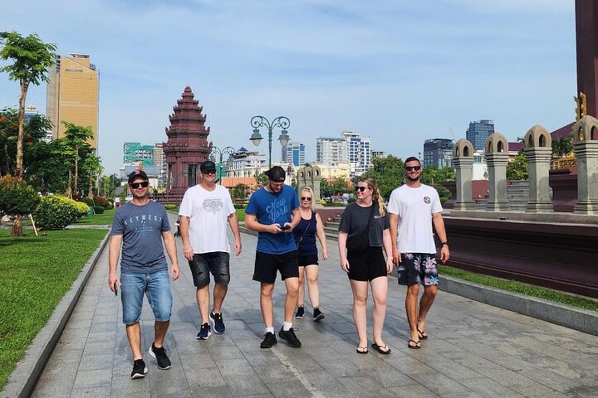 a group of people walking down a sidewalk