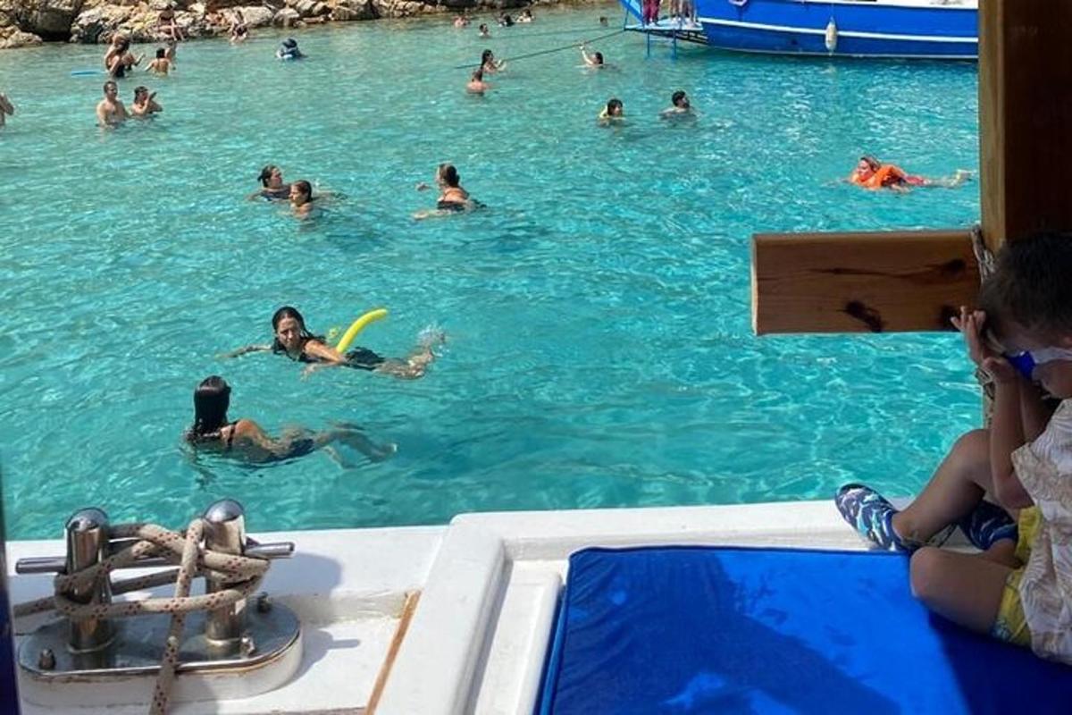 a group of people in the water at a swimming pool