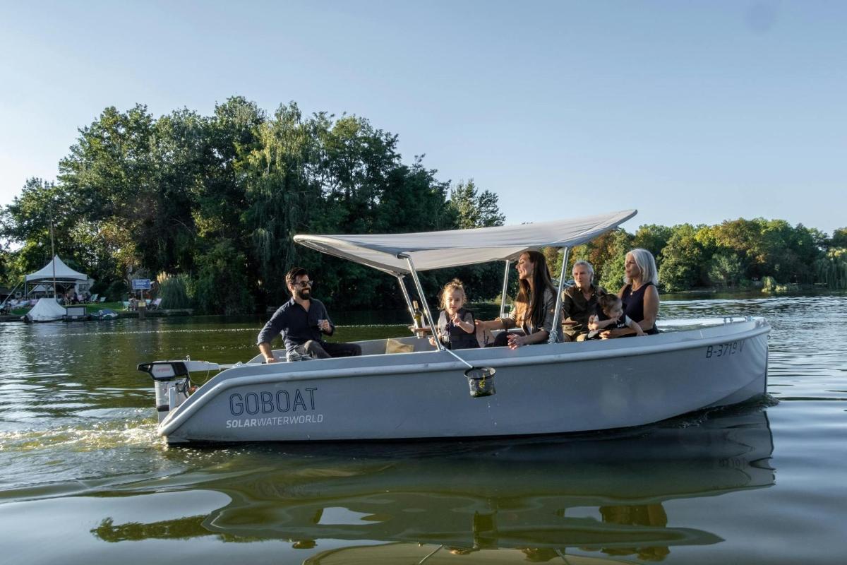 a group of people in a boat on the water