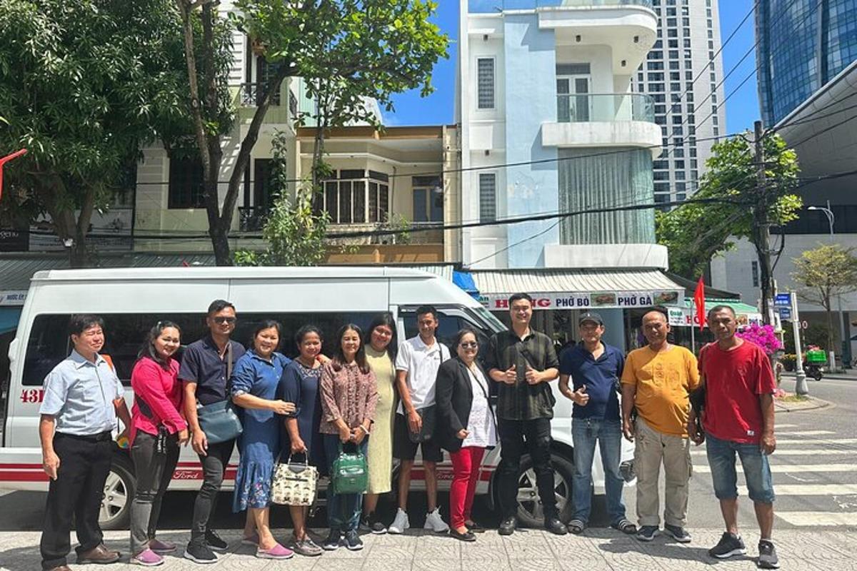 a group of people standing in front of a van