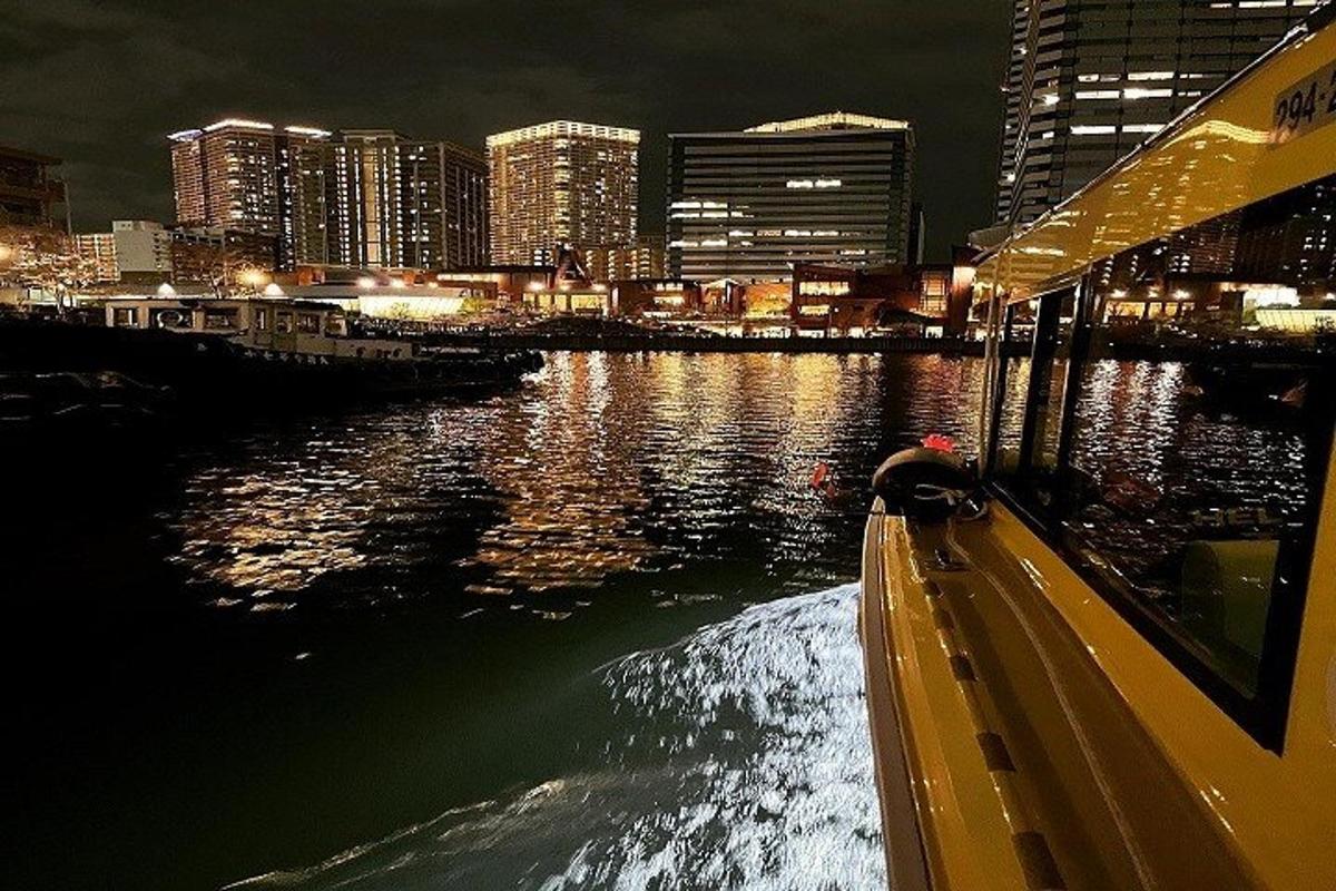 a view of a river with a city at night