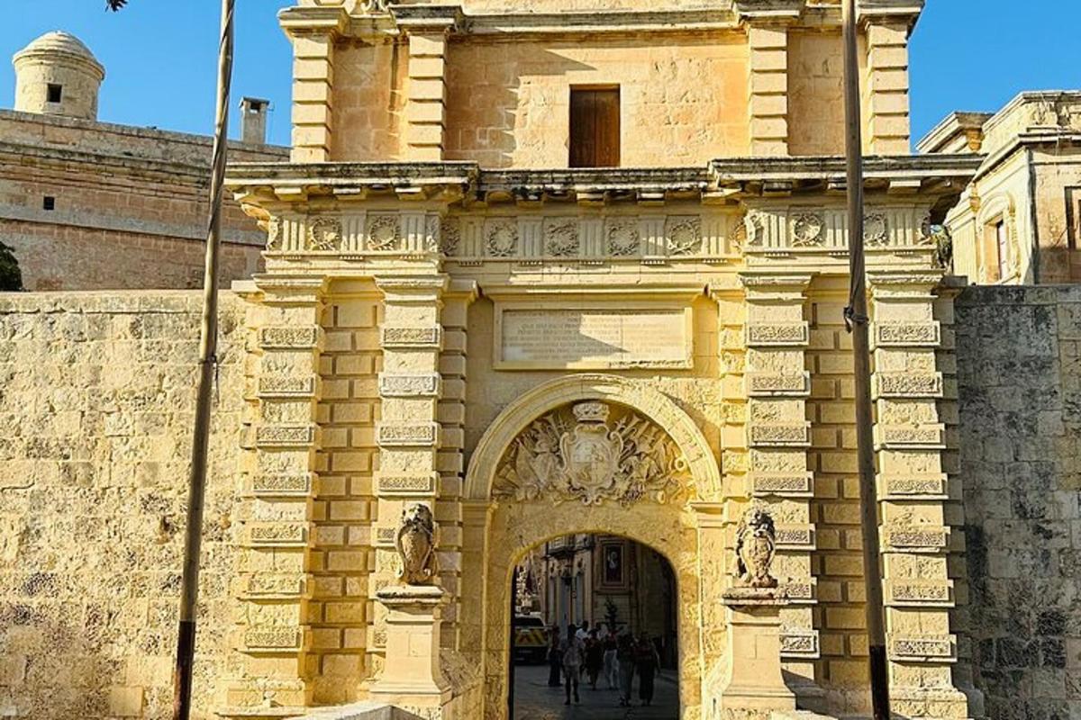 an archway in a building with people walking through it