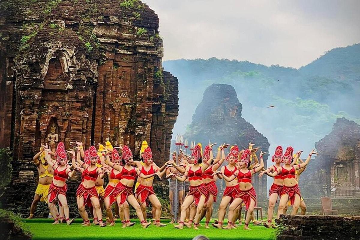 a group of people dancing in front of a building