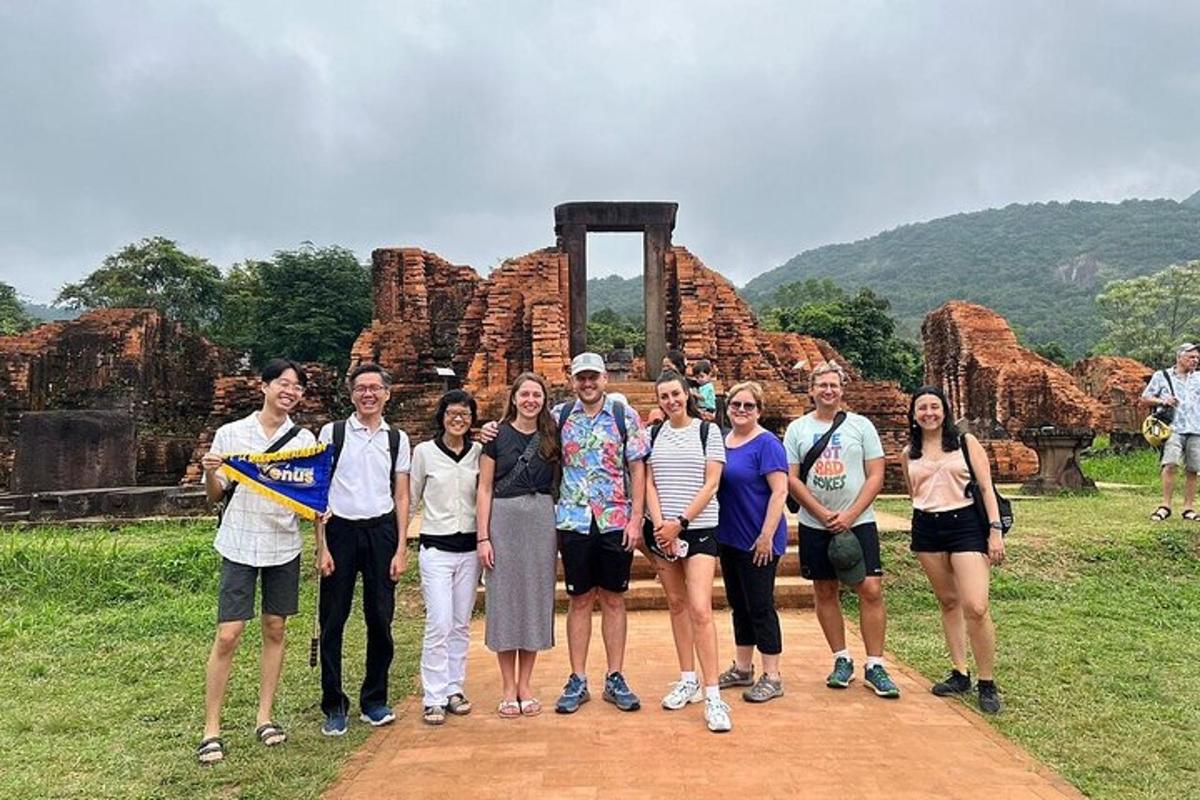 a group of people standing in front of a monument