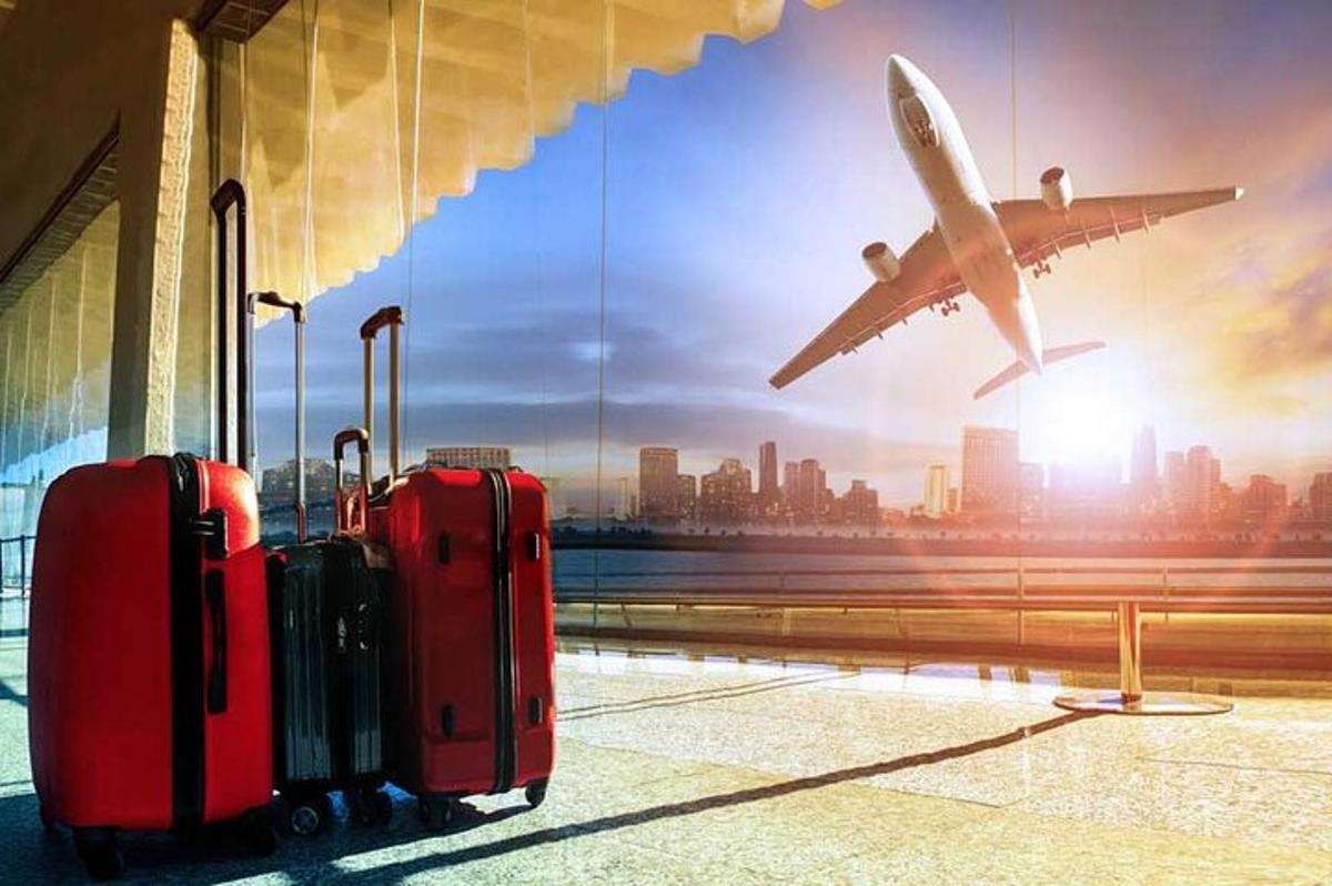 an airplane is taking off from an airport with luggage