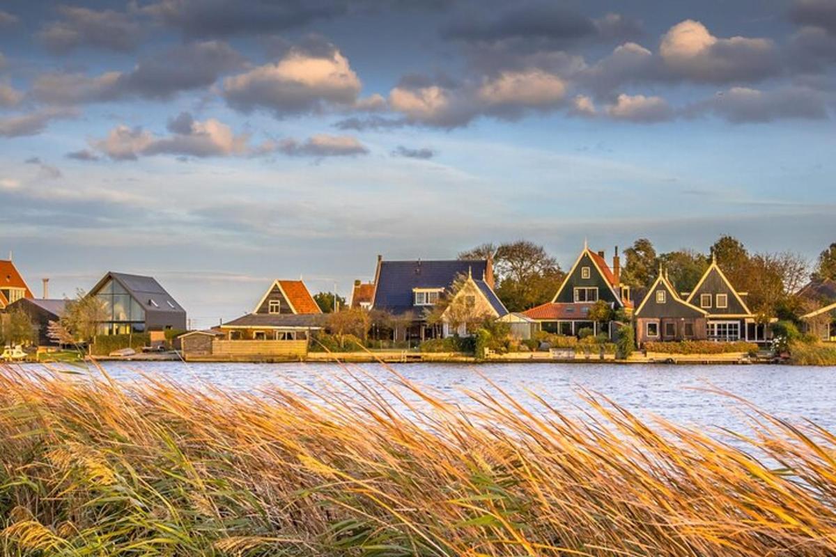 a row of houses on the shore of a body of water