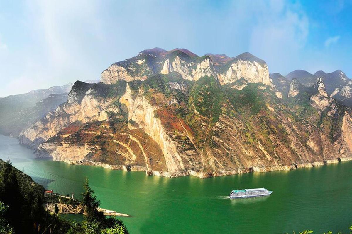 a boat on a lake in front of a mountain