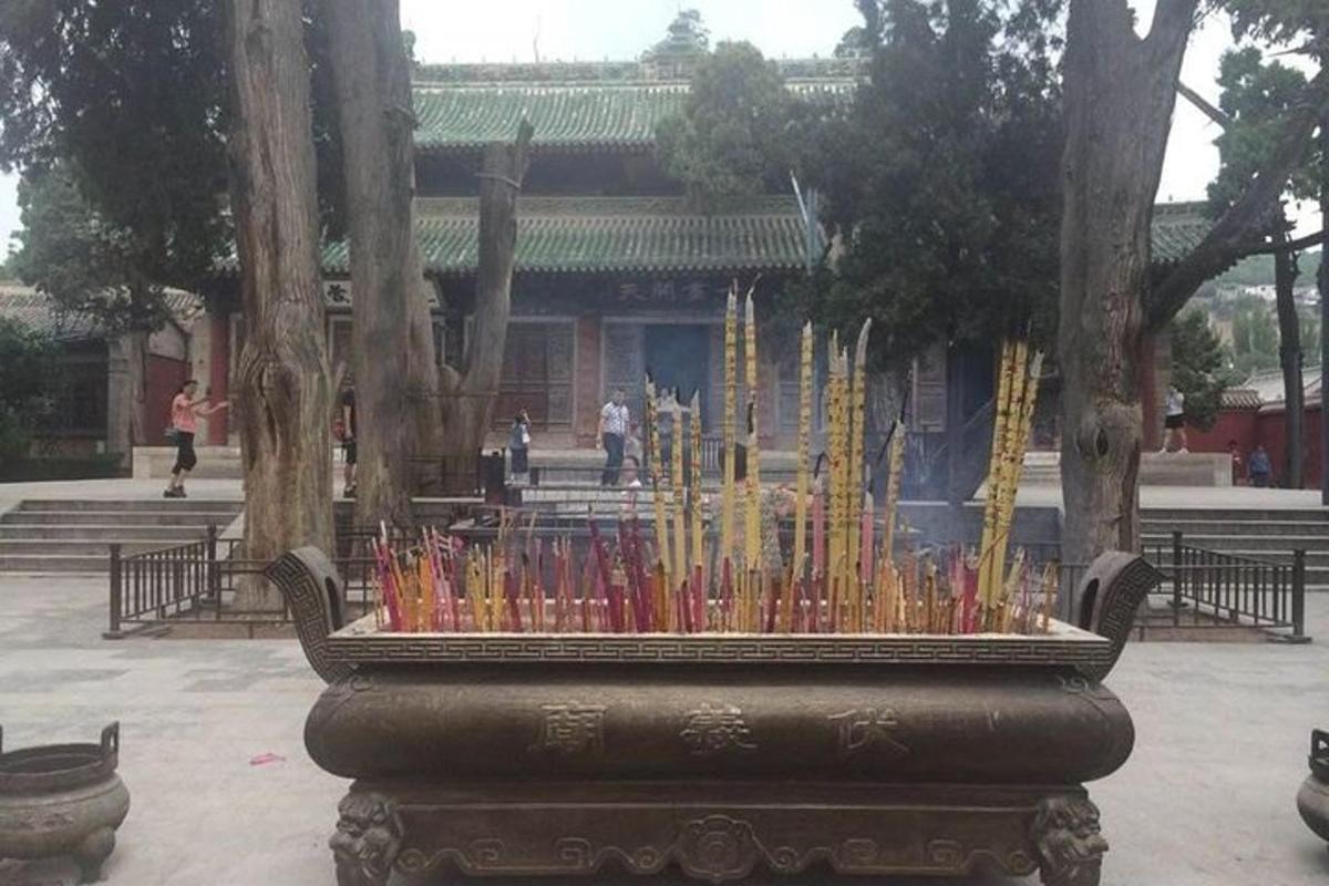 a display of colored candles in front of a building