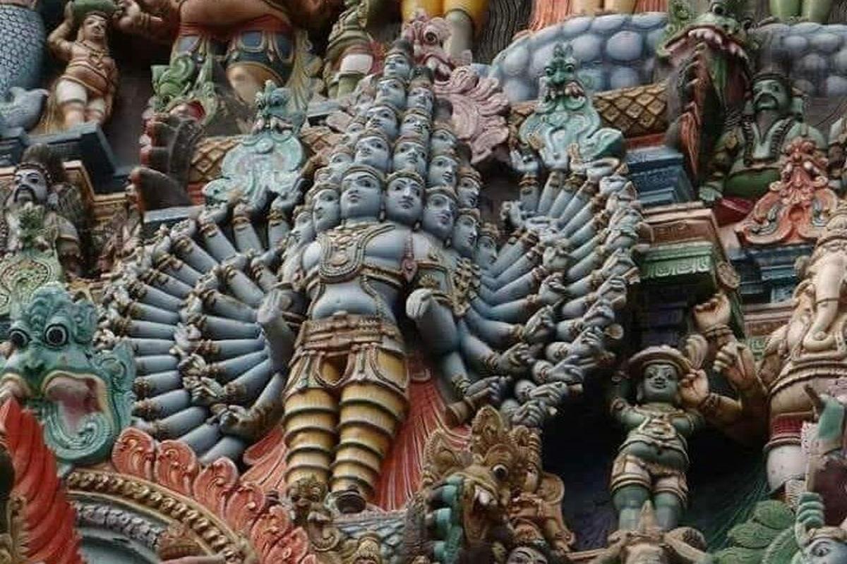 a close up of a building with many different colored statues