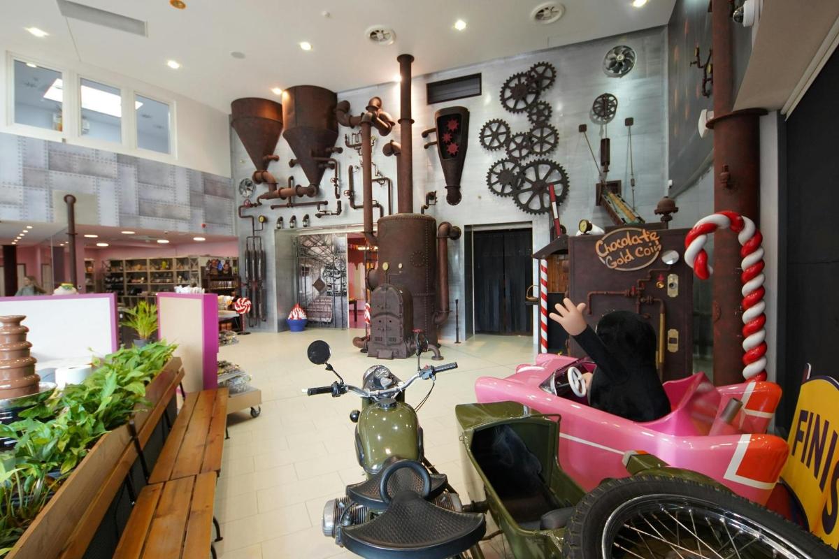 a store with a scooter in the middle of a room