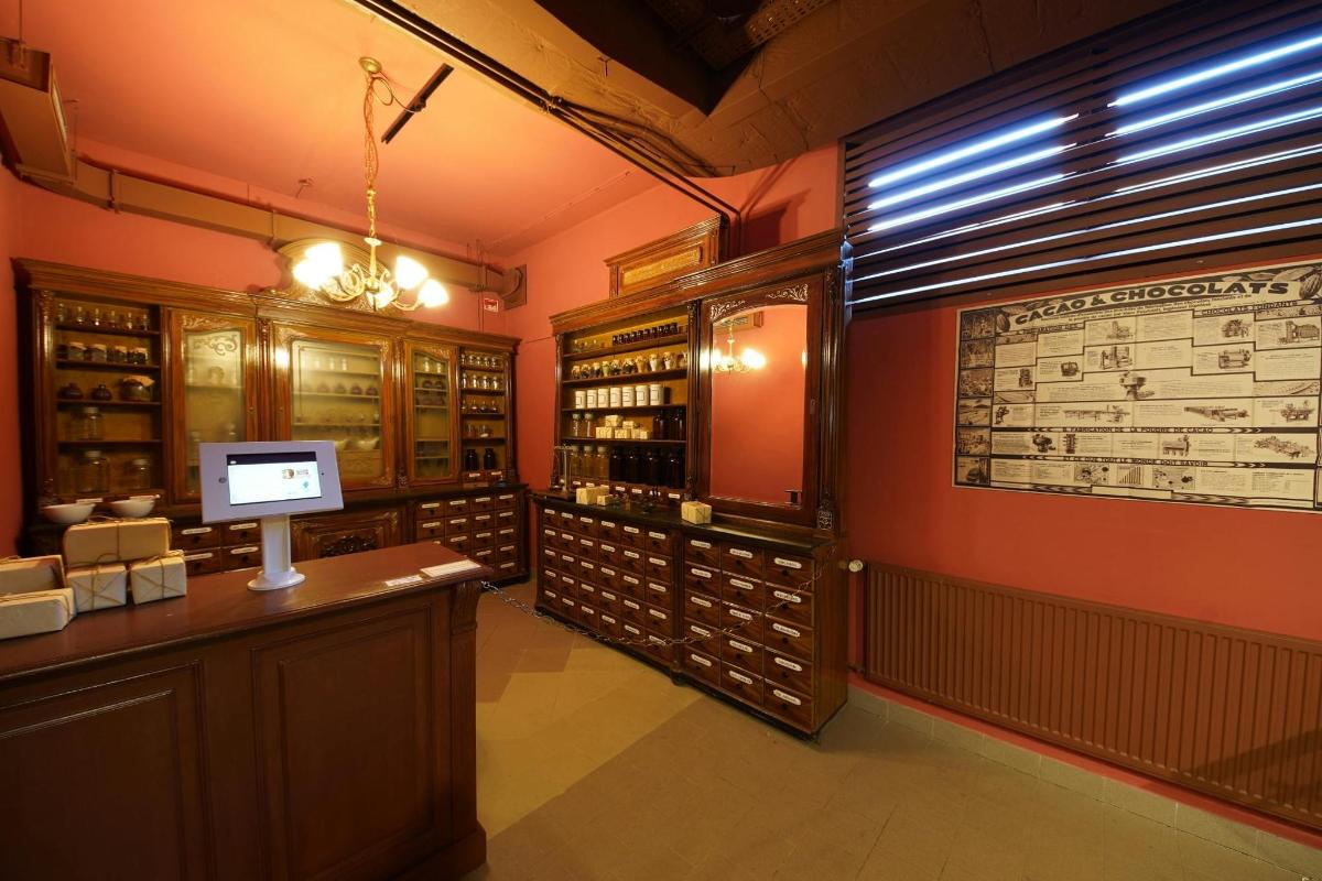 a wine tasting room with a counter and wine bottles