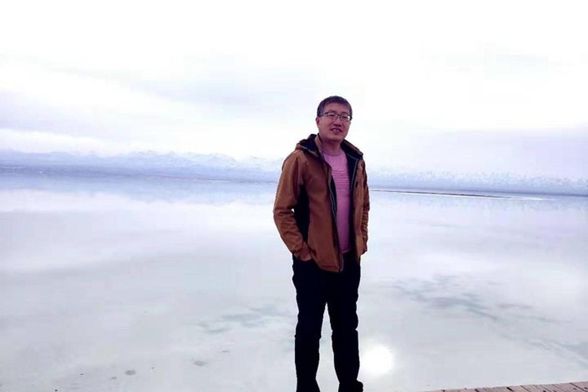 a man is standing on the beach