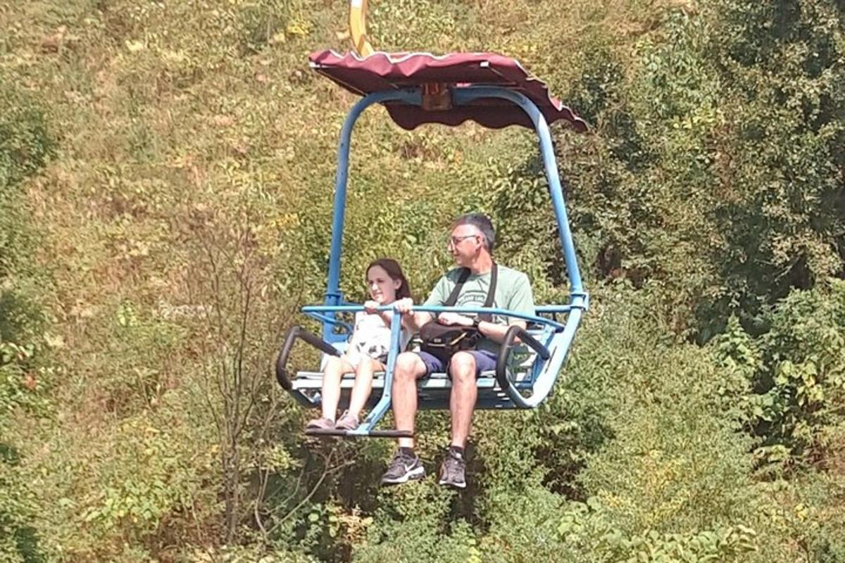 a man and a woman riding on a gondola