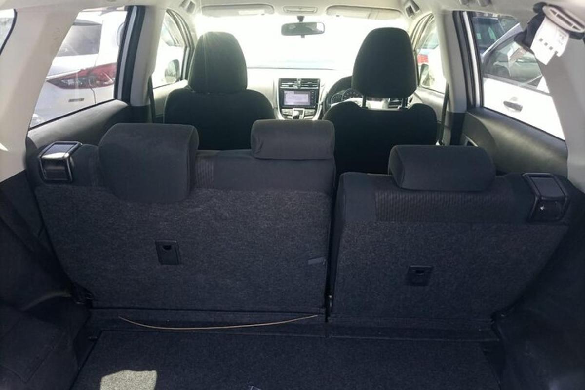 an empty back seat of a car with the back seatsktop