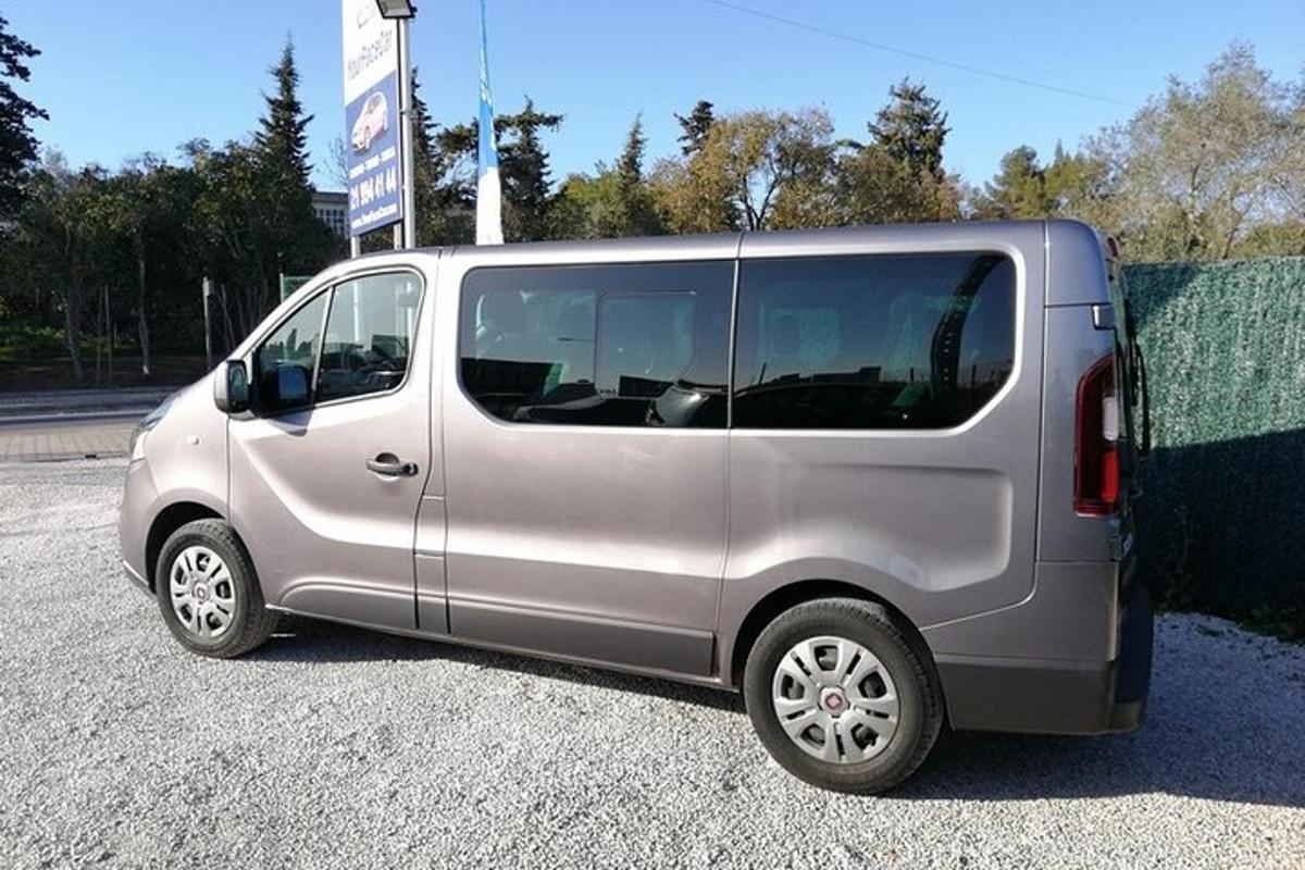 a silver van parked in a parking lot