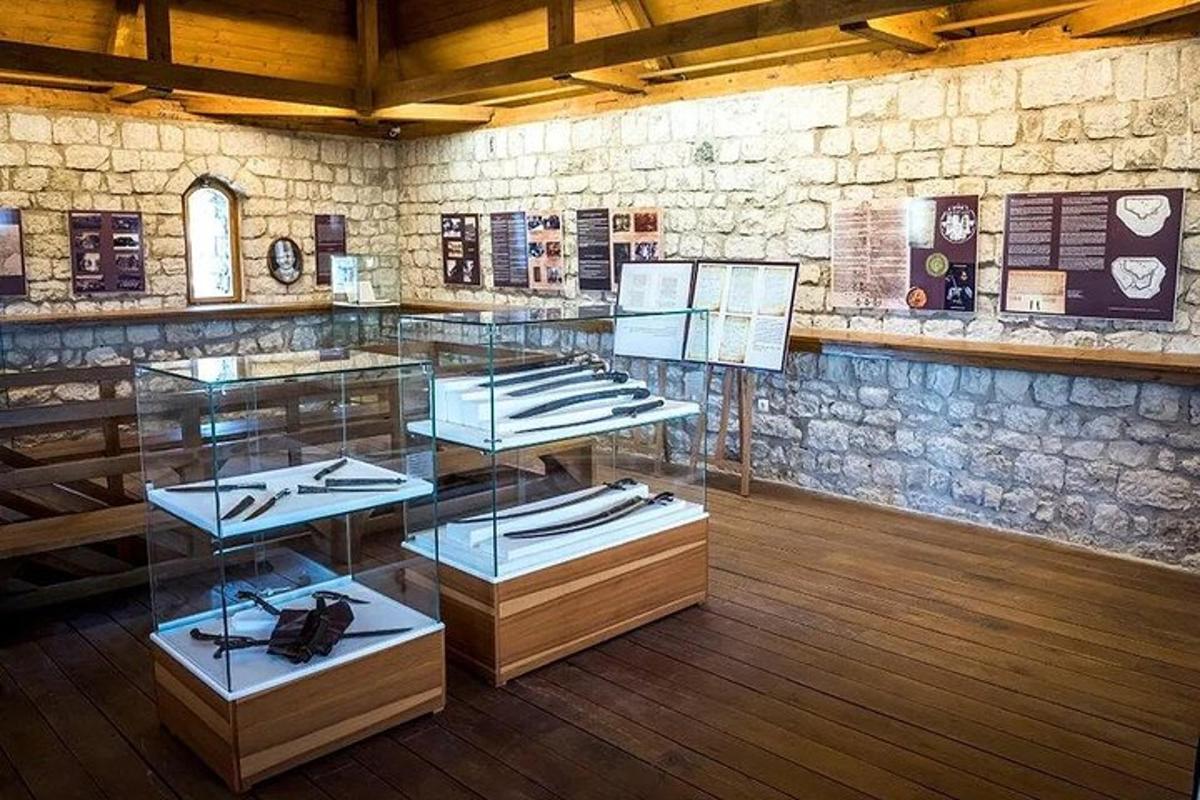 a glass display case in a room with a stone wall