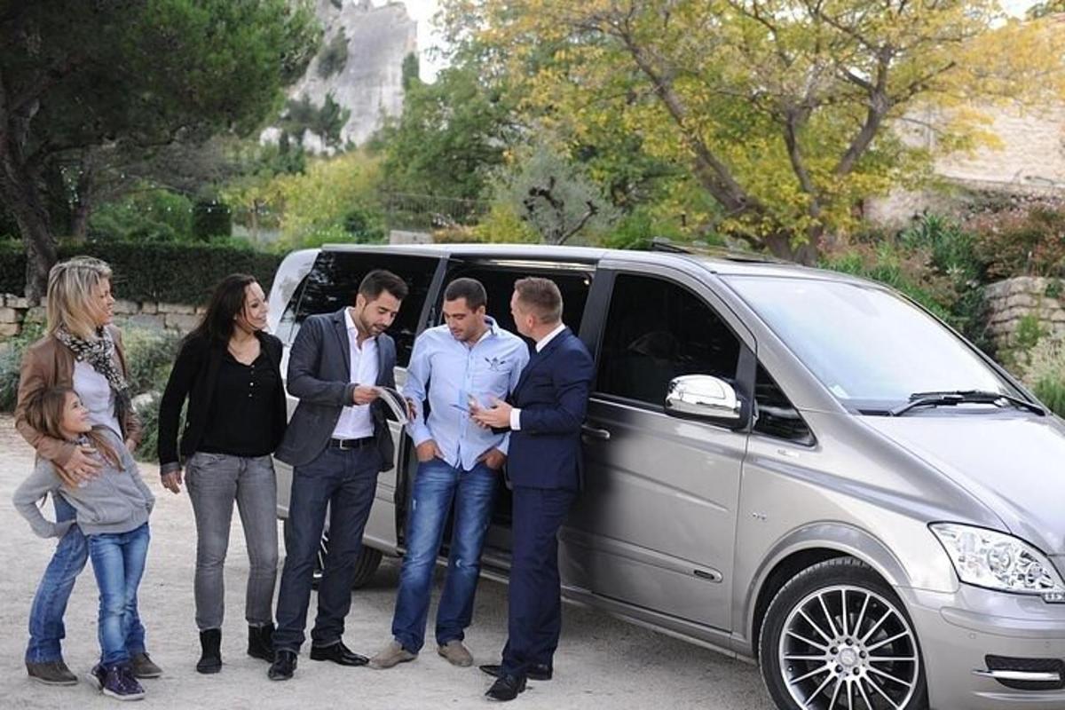 a group of people standing next to a van