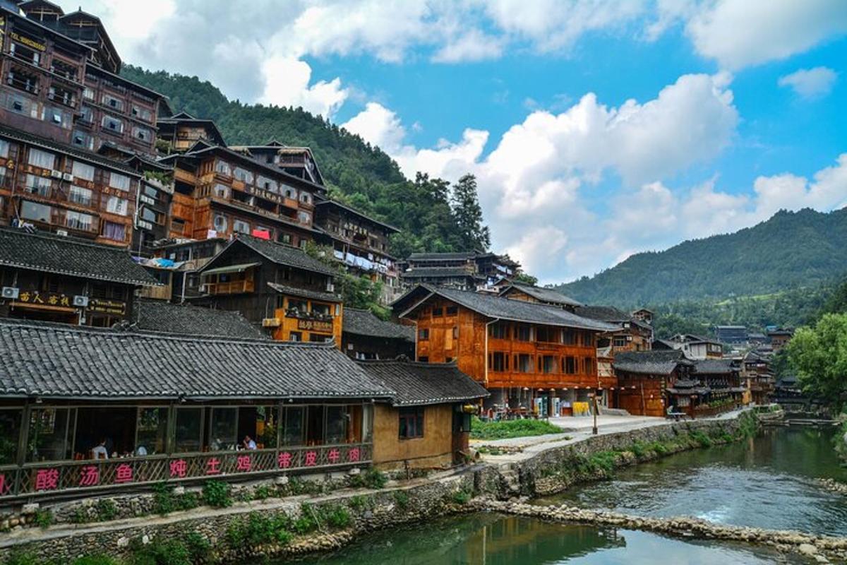 a group of buildings next to a river