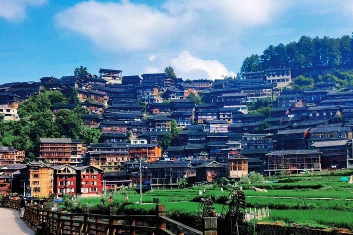 a bunch of houses on top of a hill