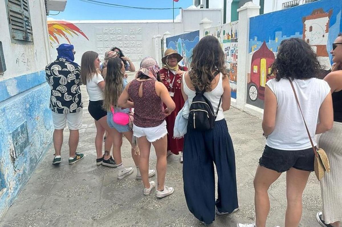 a group of people standing in front of a wall