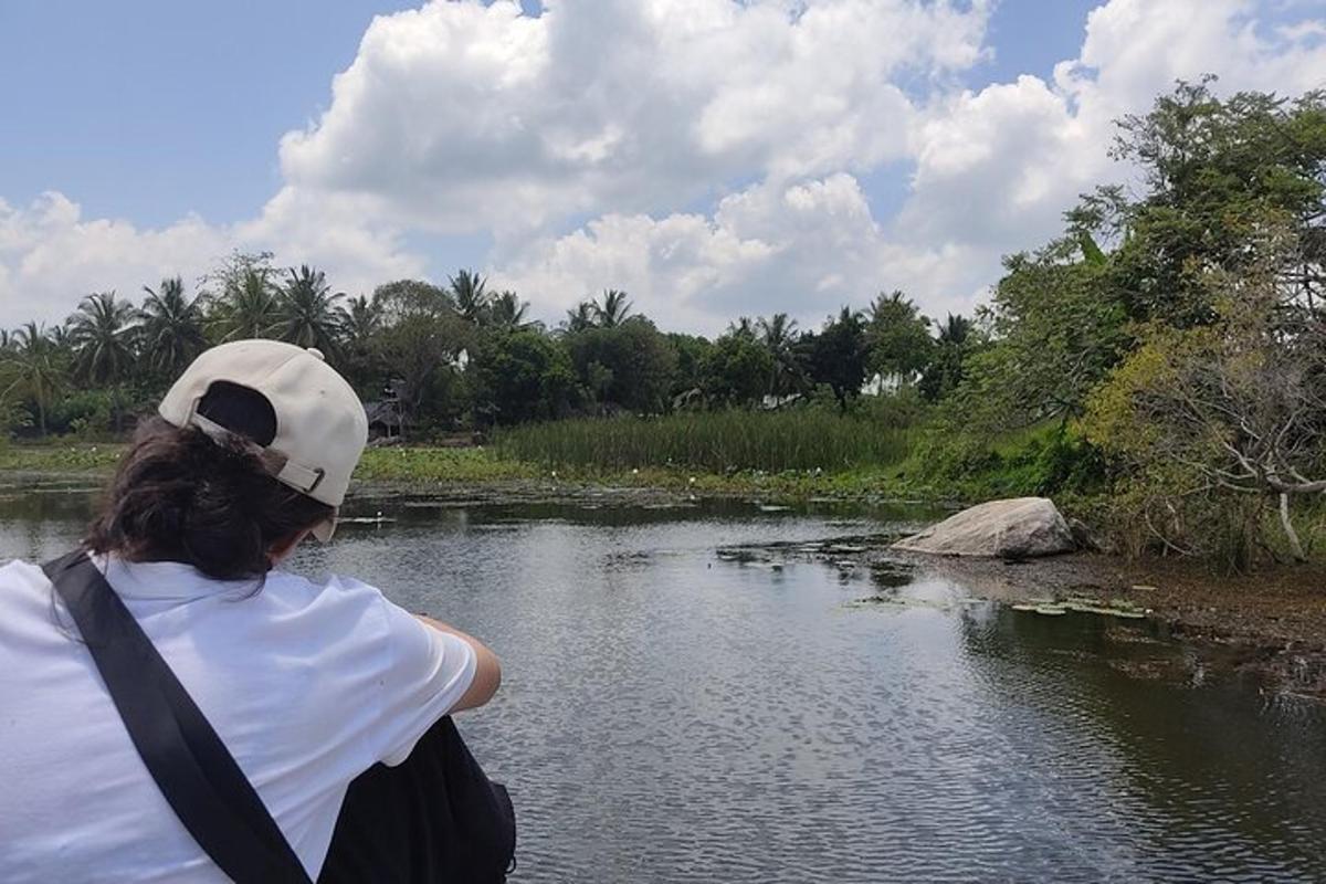a woman is looking at a river