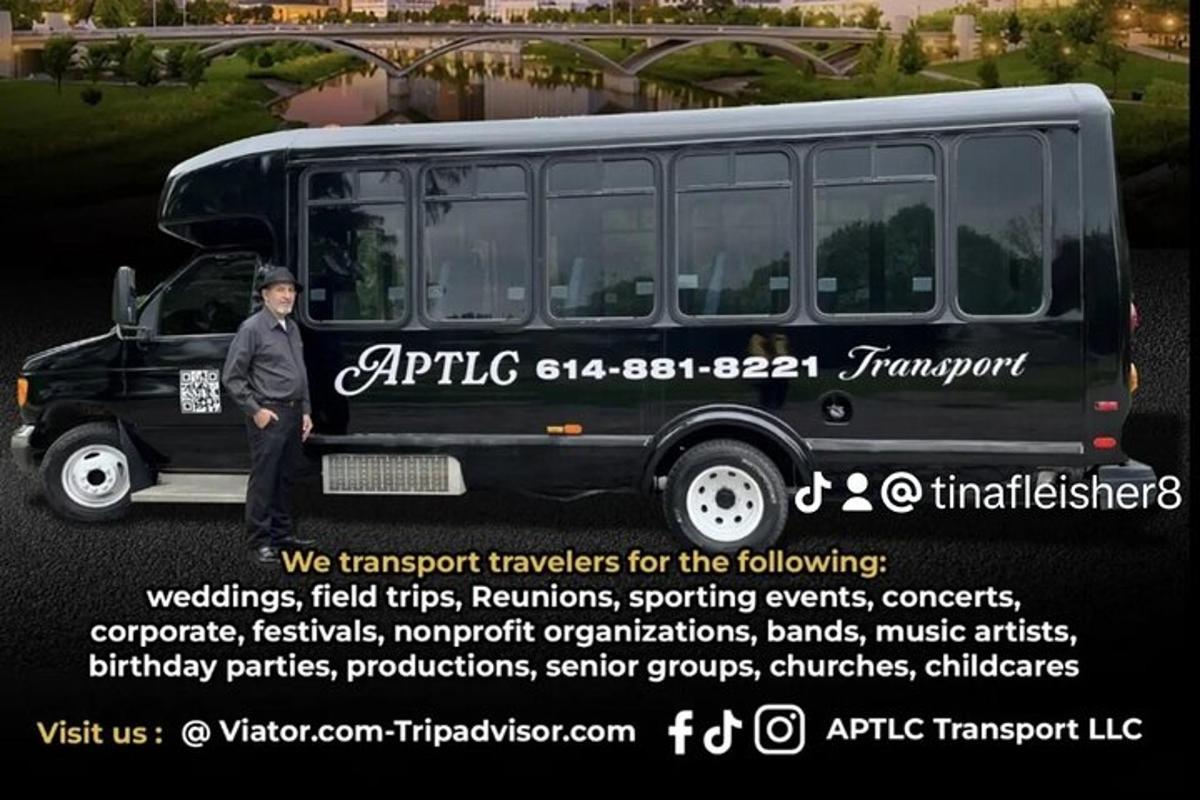 a man standing in front of a bus