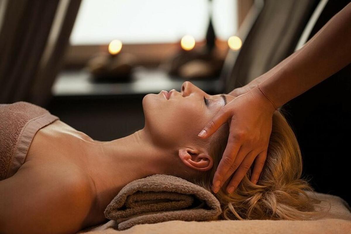 a woman getting a massage at a spa