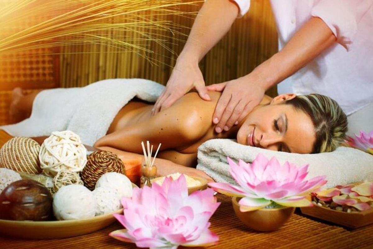a woman getting a massage in a spa tub