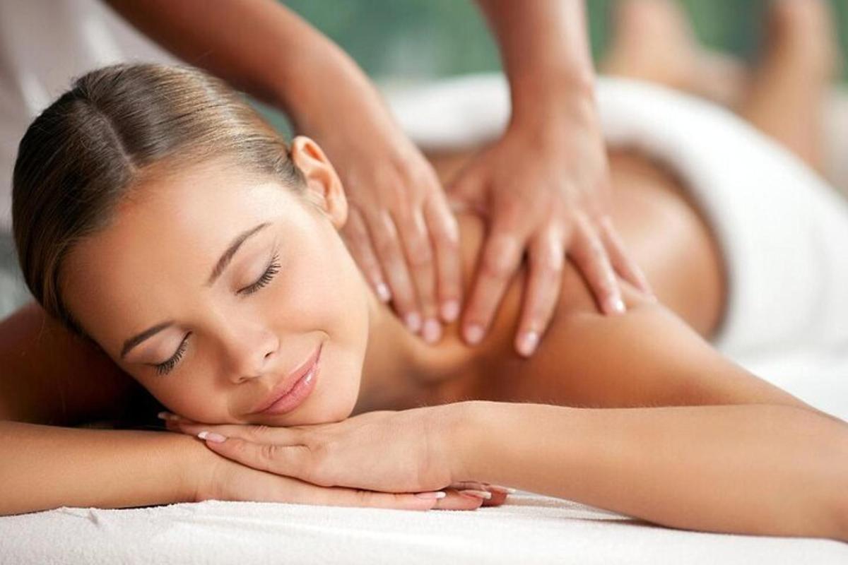 a woman getting a massage in a spa tub