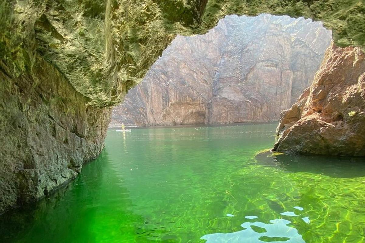 a large river with green water in a cave