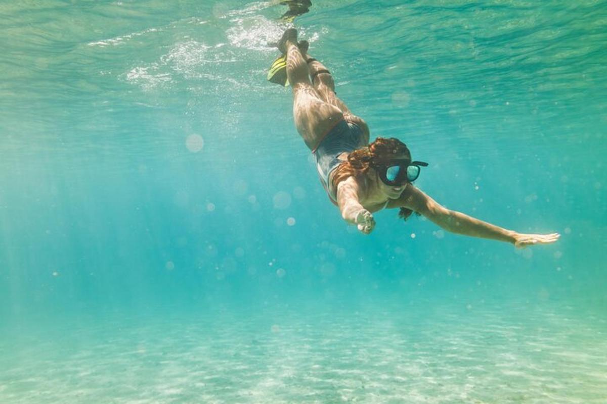 a man swimming in the water in the ocean