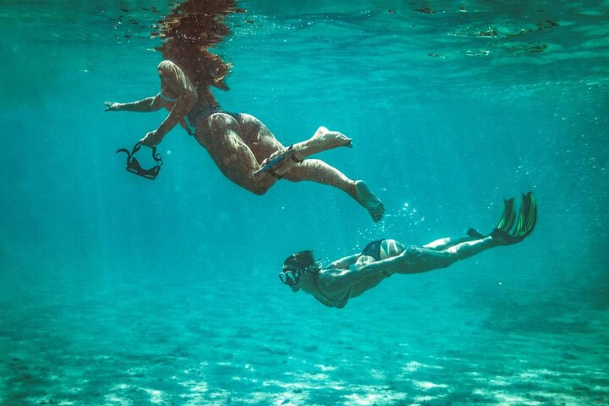 a man and a woman swimming in the water
