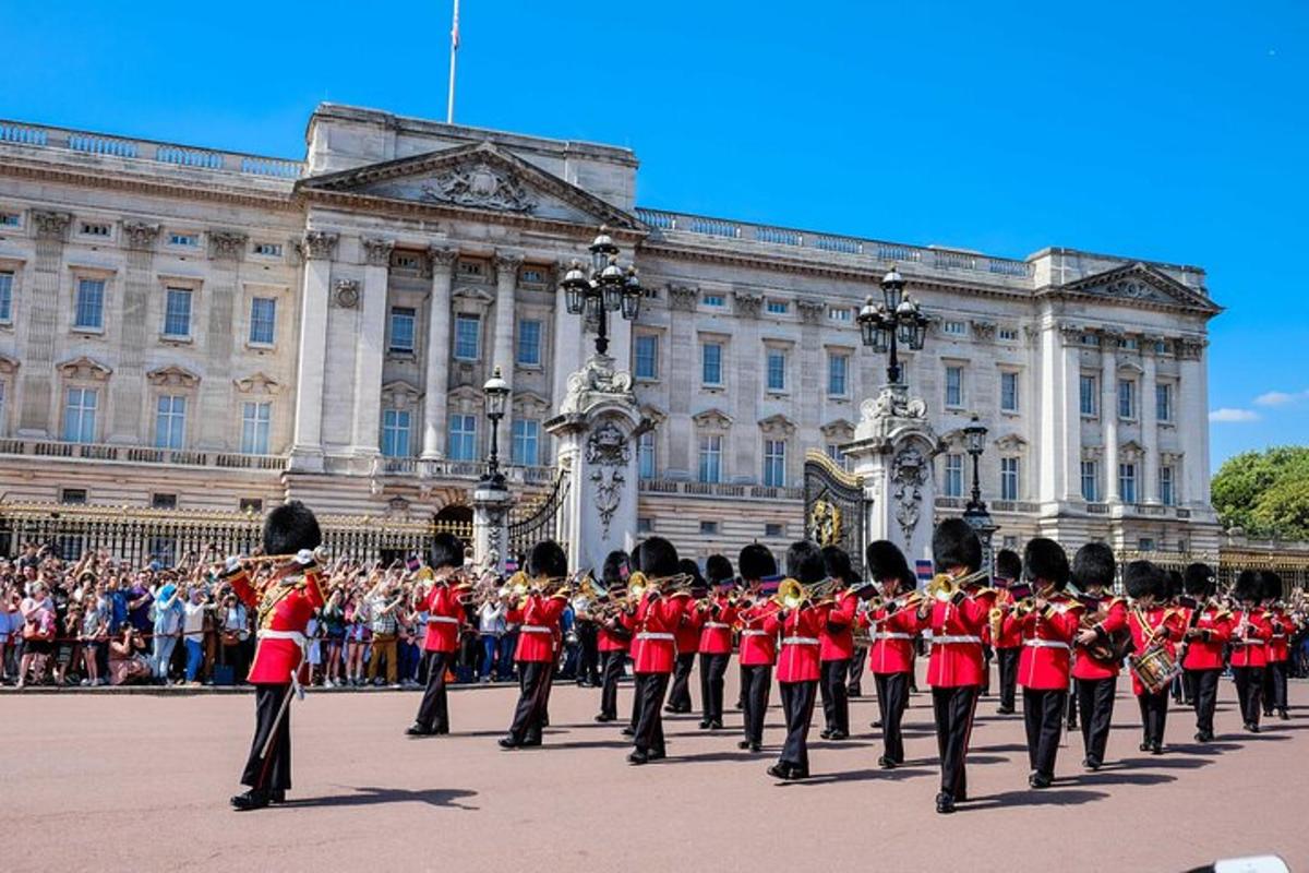 a marching band in red uniforms in front of a building