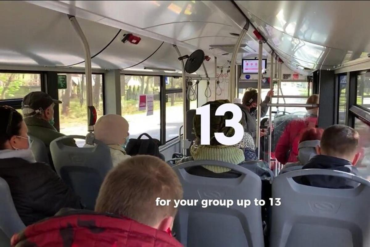 a group of people sitting on a bus