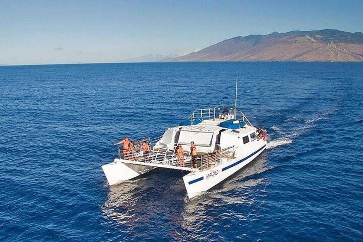 a group of people on a boat in the water