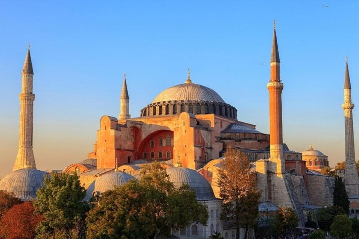 a building with domes and mosques on a hill