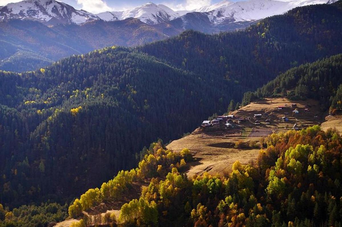 a small village on a hill in the mountains