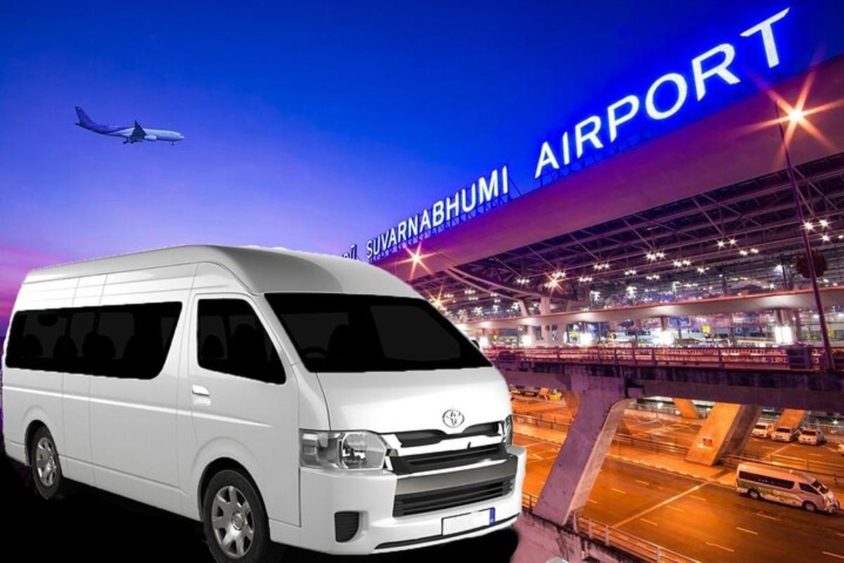 o dubă albă parcată în fața unui pod cu un avion